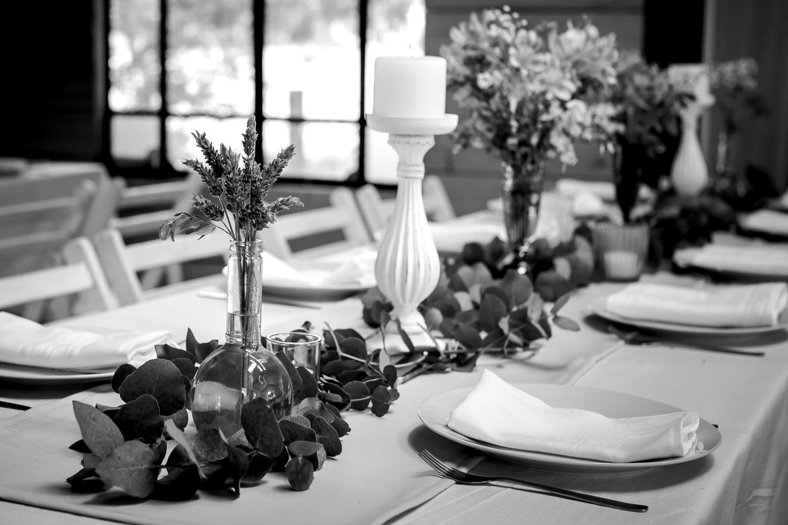 A table set for a wedding, in black and white
