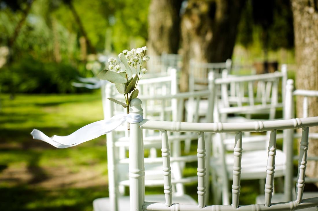 Ceremony chairs with flowers and ribbons