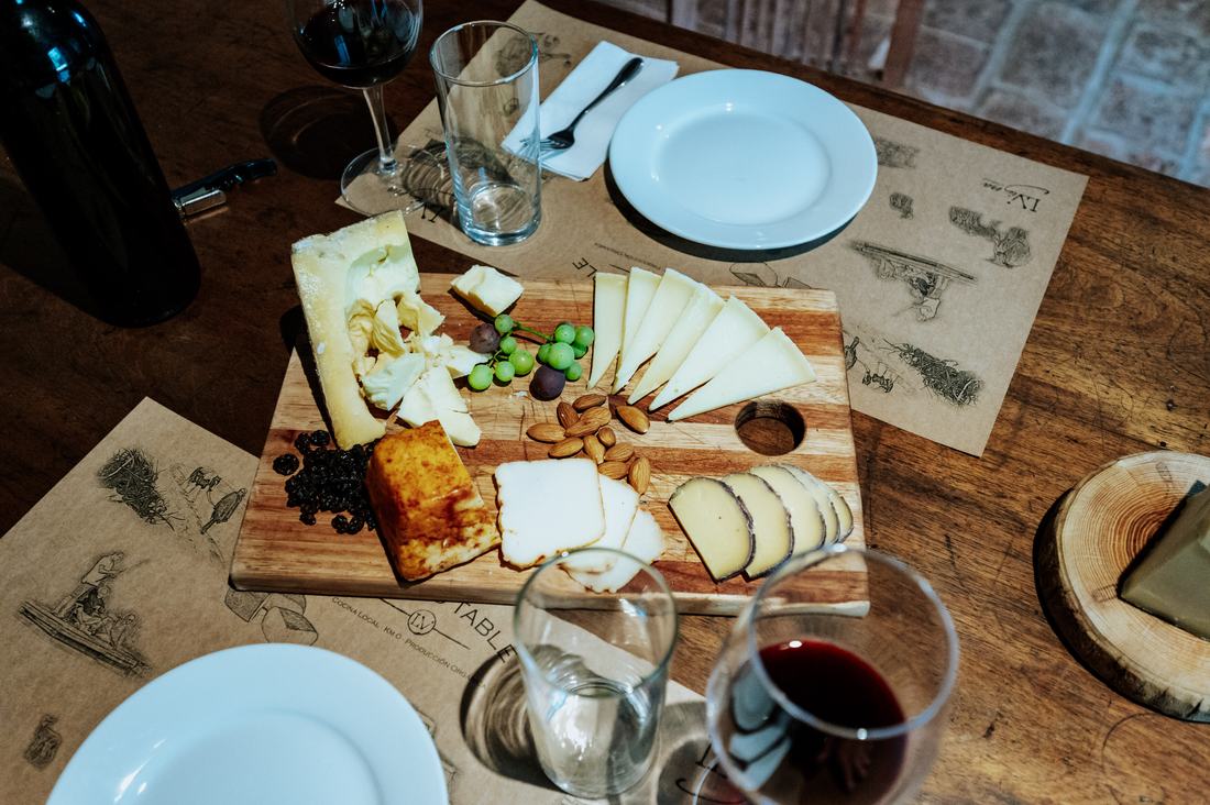 Cheese board and wine on the table