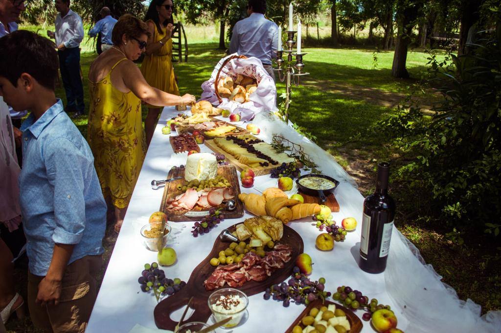 A long table set beneath the trees